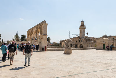 Group of people in front of historical building