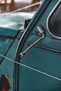 Damaged side-view mirror of vintage car