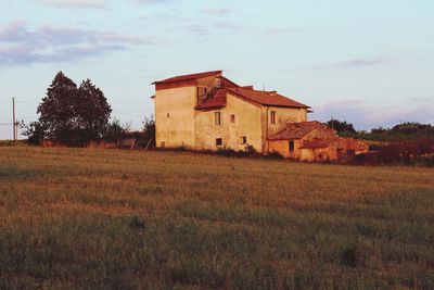 House on field against sky