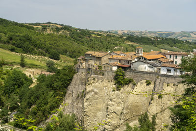 High angle view of trees and buildings against sky