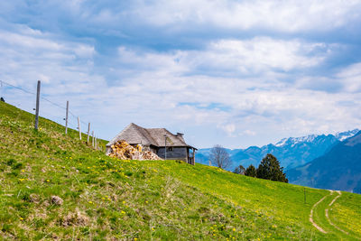 House on field against sky