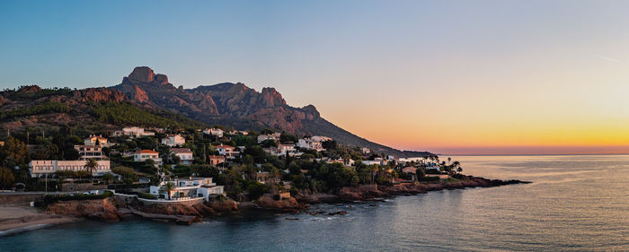 Scenic view of sea against clear sky during sunset