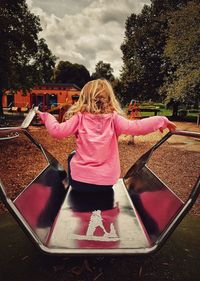 Rear view of girl in playground