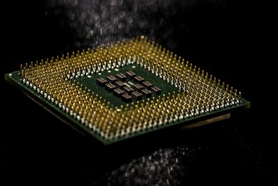 Close-up of camera over black background