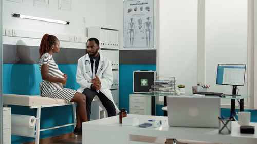 Female doctor working in office