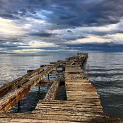 Staircase at beach against sky
