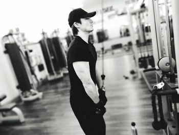 Side view of man exercising in gym