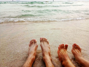 Low section of people on beach