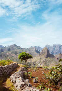 Hiking trail leading through arid rocky terrain towards caculli village on santo antao cape verde