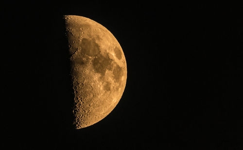 Low angle view of moon against clear sky at night