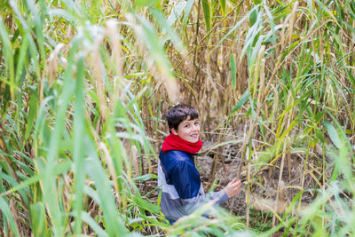 Portrait of boy on field