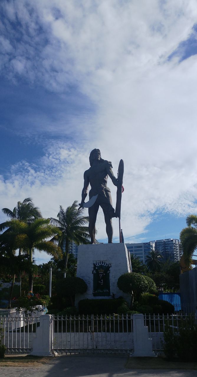 LOW ANGLE VIEW OF STATUES AGAINST SKY