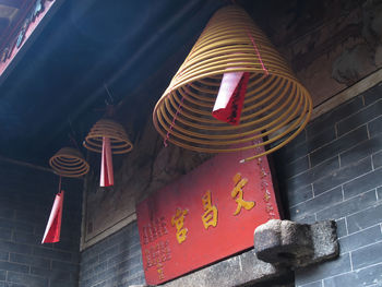 Low angle view of lanterns hanging in temple