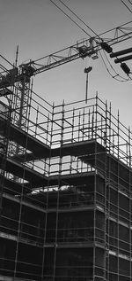 Low angle view of construction site against sky