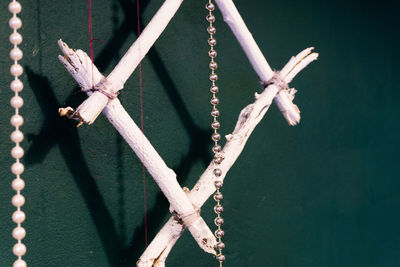 Close-up of rope tied on wood