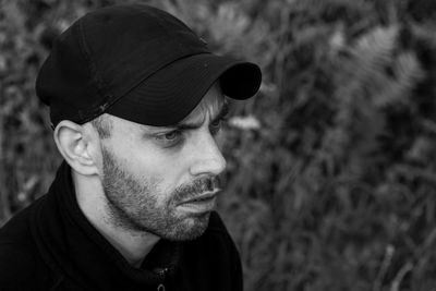 Close-up portrait of young man looking away