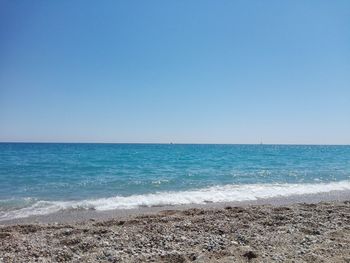 View of beach against blue sky