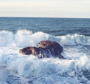 Waves splashing on rocks