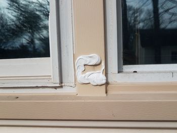 White sculpture on window of house
