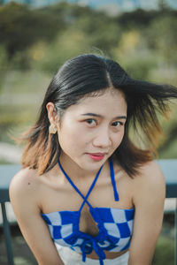 Portrait of young woman looking away