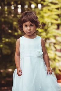 Portrait of a girl standing outdoors