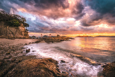 Scenic view of sea against sky at sunset