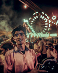 Midsection of woman with music concert at night