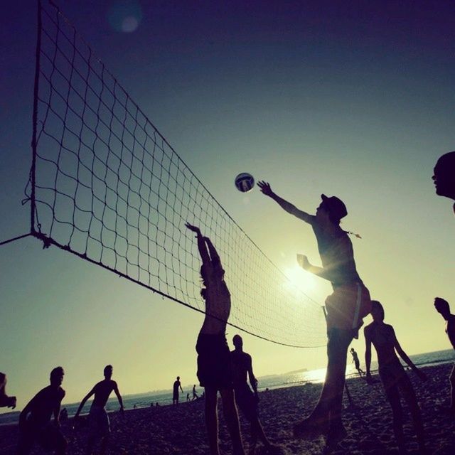 men, silhouette, leisure activity, lifestyles, large group of people, enjoyment, sunset, person, fun, arts culture and entertainment, togetherness, sky, sun, clear sky, blue, enjoying, excitement, performance, medium group of people