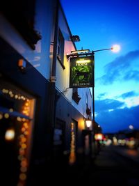 Low angle view of illuminated street light at night