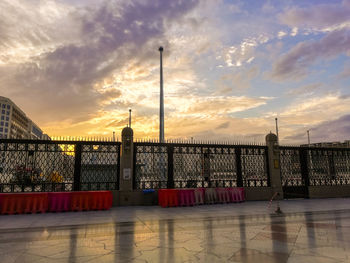 View of building against cloudy sky during sunset