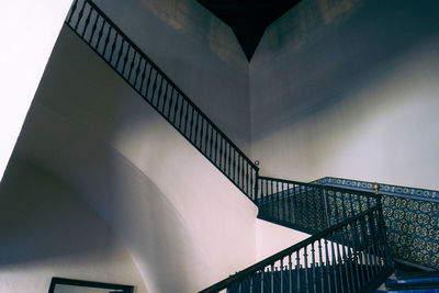 Low angle view of staircase by building against sky