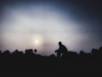 Silhouette of man at sunset