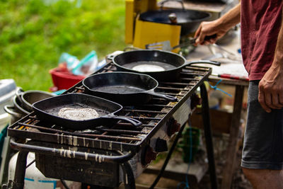 Man preparing food on barbecue grill