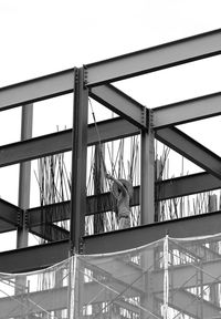 Low angle view of man bridge against sky