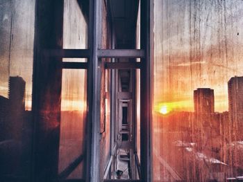 View of building in city at sunset