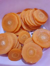 High angle view of orange slices against white background