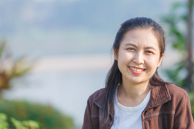 Portrait of smiling woman outdoors