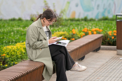 Portrait of young woman using mobile phone