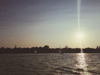 Scenic view of river at sunset