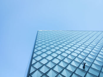 Low angle view of modern building against clear blue sky