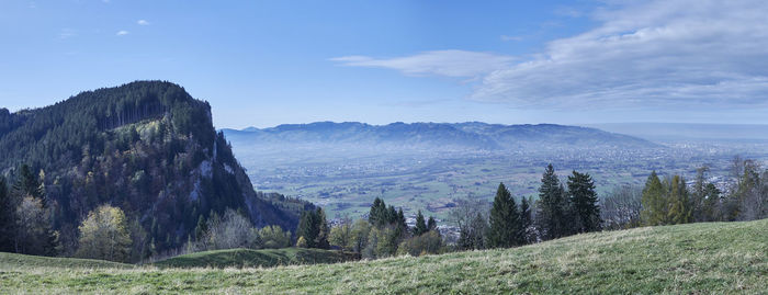 Scenic view of mountains against blue sky