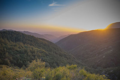 Scenic view of mountains against sky during sunset