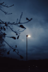 Low angle view of street light against sky at night