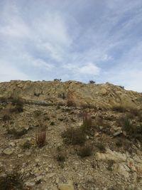 Scenic view of arid landscape against sky