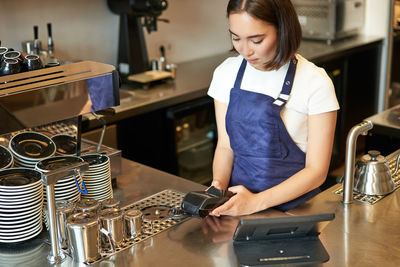 Portrait of young woman working at home