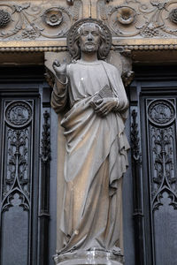 Statue of buddha against building