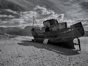 Old boat of caol with ben nevis in the background. a quiet but stunning location 
