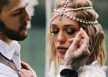 Portrait of young couple looking away