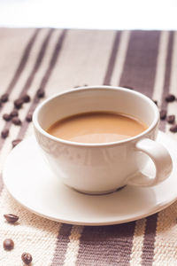 Close-up of coffee cup on table