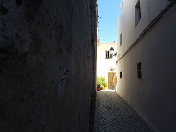 Narrow alley along buildings